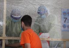 فحوصات كورونا في معبر رفح للعائدين إلى غزة 