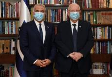 الرئيس الإسرائيلي رؤوفين ريفلين ويائير لابيد