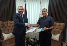 جانب من توقيع وزارة العمل واتحاد المقاولين الفلسطينيين