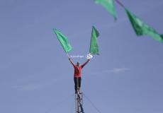 أنصار حركة حماس خلال مسير في ذكرى الإنطلاقة الـ34 للحركة