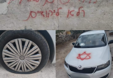 إعطاب إطارات وخط شعارات لمركبات فلسطينية