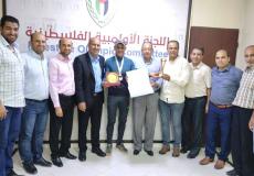غزة: اللجنة الأولمبية تكرم سعيد تمراز وبطل الترايثلون محمد عطاالله