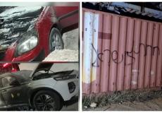 مستوطنون يحرقون مركبتين ويخطون شعارات عنصرية شرق رام الله