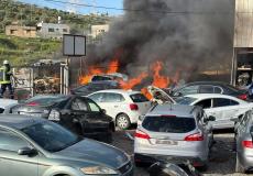 مستوطنون يحرقون مشطبا للمركبات في دير شرف