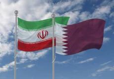 أعلام قطر وإيران