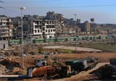 عدد من الحافلات التي ستنقل المهجرين من الأحياء المحاصرة