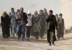 مدنيون عراقيون يفرون من المعارك في الموصل