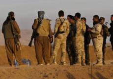 مجموعة من مسلحي البيشمركة الاكراد في سهل نينوى الى الشمال الشرقي من الموصل 