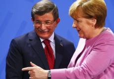 ميركل مع داوود أوغلو في برلين