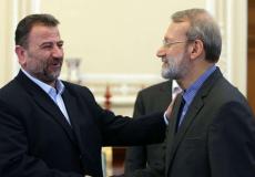 نائب رئيس المكتب السياسي لحركة حماس صالح العاروري و القيادي الإيراني علي لاريجاني