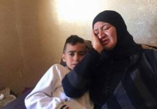 فلسطينية تودع ابنها الشهيد بالضفة
