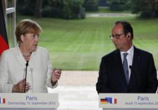 المستشارة الألمانية أنجيلا ميركل والرئيس الفرنسي فرانسوا هولاند في لقاء بباريس