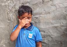 طفل يبكي خلال وداعه أحد شهداء مسيرة العودة في غزة -صورة ارشيفية-