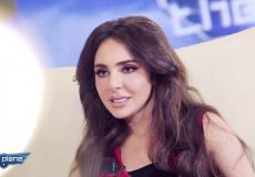 عريب حمدان خلال مشاركتها في برنامج THE PLACE