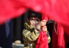 طفل يشارك في تظاهرة للمطالبة بانهاء الانقسام في غزة