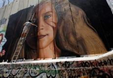 جدارية  عهد التميمي التي قام  برسمها  فنانين  إيطالين في بيت لحم 