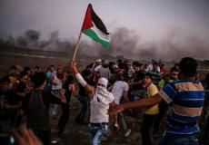 متظاهرين في مسيرة العودة قرب حدود غزة