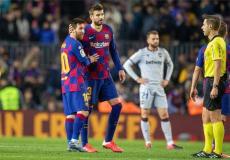 ميسي وبيكيه على أرض ملعب الكامب نو