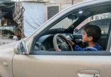 طفل يقود سيارة -ارشيف-