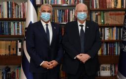 الرئيس الإسرائيلي رؤوفين ريفلين ويائير لابيد