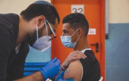 تطعيم عمال فلسطين بفيروس كورونا