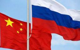 علم روسيا الصين- تعبيرية.