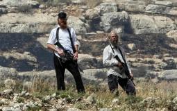 مستوطنون يحملون السلاح - أرشيف