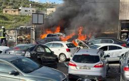 مستوطنون يحرقون مشطبا للمركبات في دير شرف