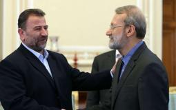 نائب رئيس المكتب السياسي لحركة حماس صالح العاروري و القيادي الإيراني علي لاريجاني