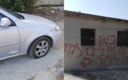 مستوطنون يخطون شعارات عنصرية ويعطبون سيارات جنوب نابلس