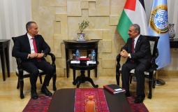 اشتية وملادينوف