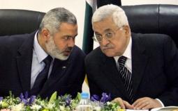 الرئيس الفلسطيني محمود عباس ورئيس حركة حماس اسماعيل هنية