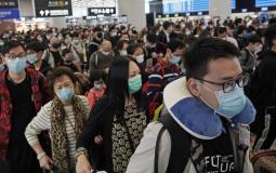 صينيون يضعون كمامات واقية من فيروس كورونا