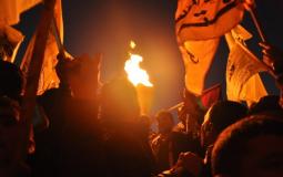 إيقاد الشعلة من أنصار حركة فتح - أرشيفية