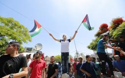 مسيرة أمام مقر الأمم المتحدة في غزة رفضا لمؤتمر البحرين / عدسة: وكالة سوا