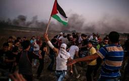 متظاهرين في مسيرة العودة قرب حدود غزة