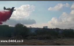 طائرة تخمد حريقا كبيراً على حدود غزة