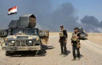 قوات عراقية خلال اشتباكات مع مسلحي تنظيم 