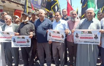 خالد البطش خلال المشاركة في المسيرة بغزة