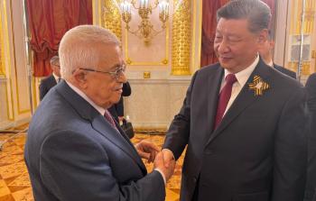 الرئيس عباس خلال لقائه الرئيس الصيني