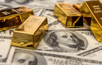 الدولار والذهب - تعبيرية