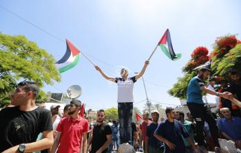 مسيرة أمام مقر الأمم المتحدة في غزة رفضا لمؤتمر البحرين / عدسة: وكالة سوا