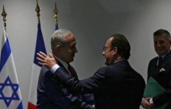 لقاء الرئيس الفرنسي فرانسوا هولاند (وسط) برئيس الوزراء الإسرائيلي بنيامين نتنياهو على هامش قمة المناخ في فرنسا عام 2015