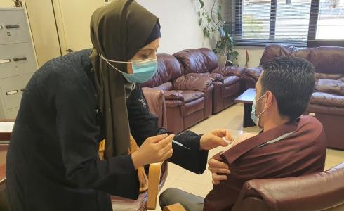 تطعيم ضد كورونا لموظفيين بنك الأردن