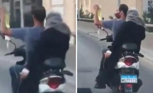 لبناني يسعف مريضة على دراجة نارية حاملاً المحلول لها وهو يقود!