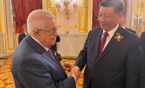 الرئيس عباس خلال لقائه الرئيس الصيني