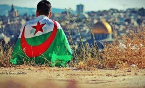 شاب فلسطيني يرتدي علم الجزائر في القدس