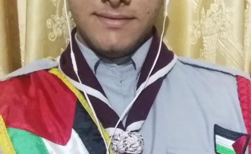 طالب من غزة يمثل فلسطين في المخيم الكشفي العربي