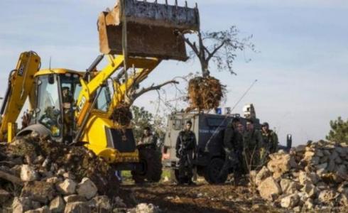 مستوطنون يجرفون أراضي في قرية بورين جنوب نابلس
