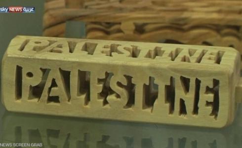 فلسطينية تبدع ابتكارات من خشب الزيتون